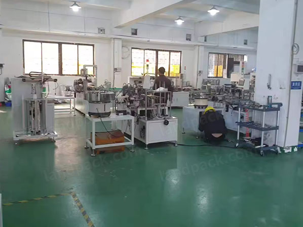 spout insert machine